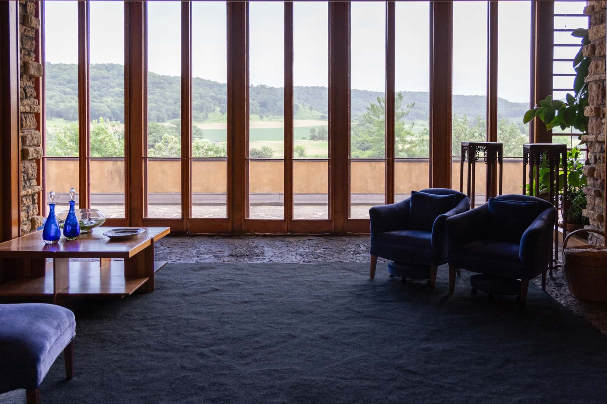A window wall framing the valley view at Taliesin